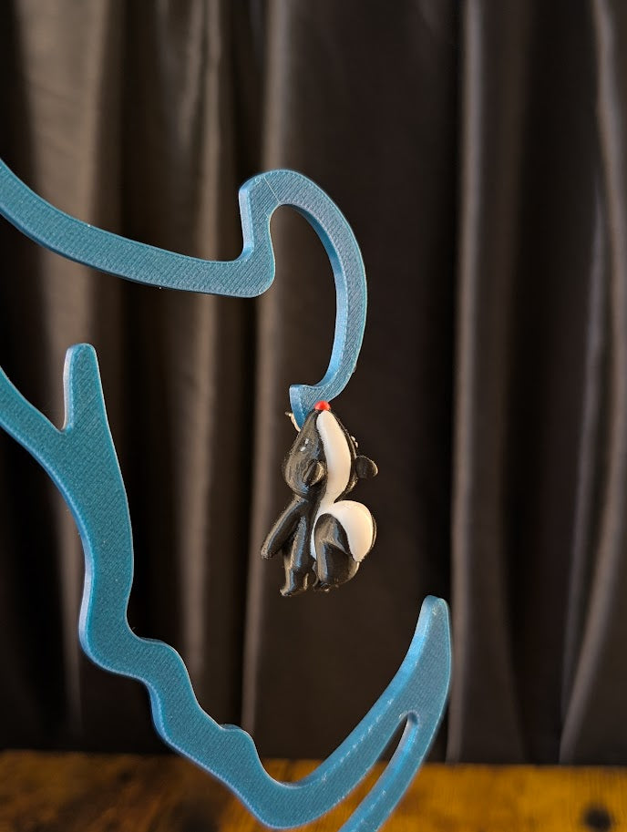 Stinky the Skunk Chomper Earring
